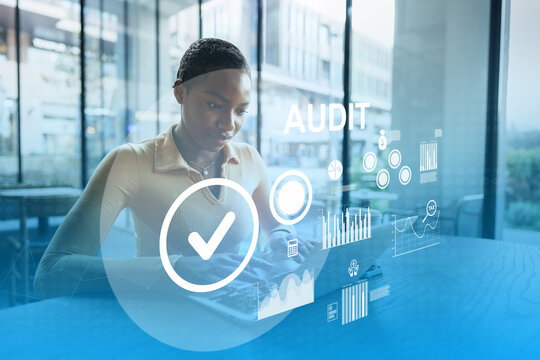 Professional conducting an audit using a digital device in a modern office setting - Powered by Adobe