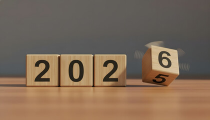 Wooden blocks show the year changing from 2025 to 2026 for new year celebrations and business planning