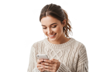 Smiling young woman wearing a cozy knit sweater holding and looking at her smartphone isolated on transparent background