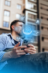 Man using smartphone to access legal services outdoors in a city setting
