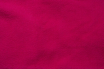 Fototapeta premium Close-up of a vibrant pink fabric texture for backgrounds and designs