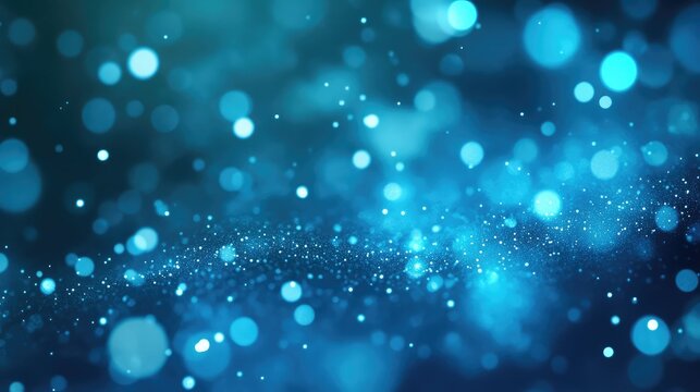 Blue bokeh particles flowing creating abstract light background