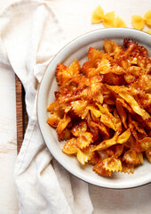 Crunchy fried pasta chips with dips.