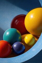 A Vibrant Cluster of Glossy Spheres Nestled in a Blue Curve Under Hard Light.