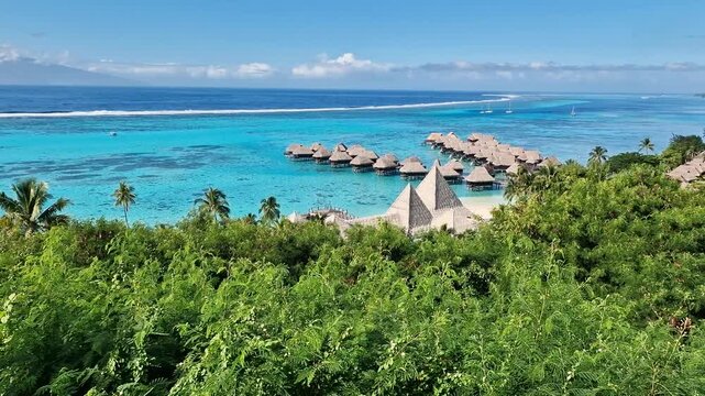 Moore Island, French Polynesia. Overwater Bungalows of Luxury Tropical Resort and Turquoise Lagoon