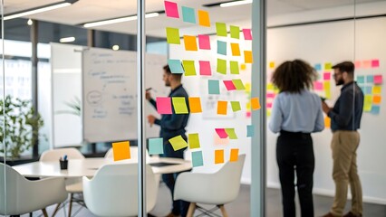 Agile Business Team Brainstorming with Sticky Notes on Glass Wall
