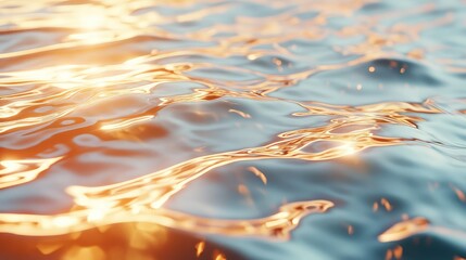 Golden light reflecting on rippling water surface at sunset