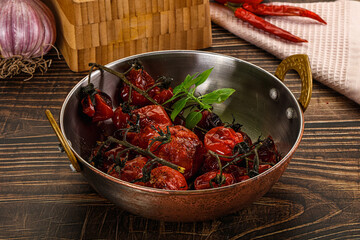 Baked cheeryy momatoes with olive oil