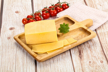 Yellow cheese piece with slices