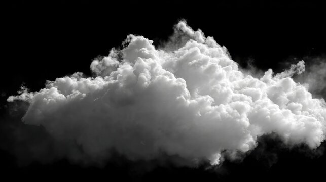 Fluffy white cloud floating against a dark background fills the scene with a sense of calm and mystery during an evening sky