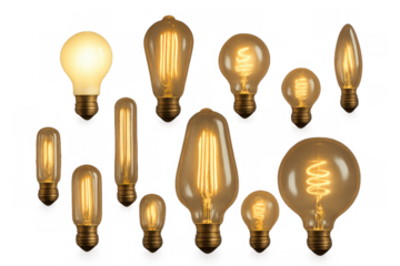 Vintage edison style light bulbs collection illuminating and glowing with warm filament light on transparent background