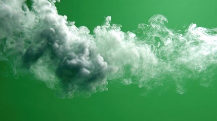 Colorful smoke on green background creates a surreal atmosphere for artistic projects and visual displays
