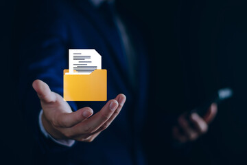 Document management digital document paperless operation concept, Businessman holding e-document in hand and use technology to organize documents online management Storage on cloud computing