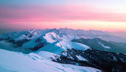 A breathtaking panoramic view of snow-covered mountain peaks under a colorful sunrise sky, with dark evergreen trees on the slopes.