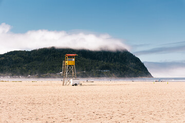 Lifeguard tower on empty beach during summer morning in Seaside, OR