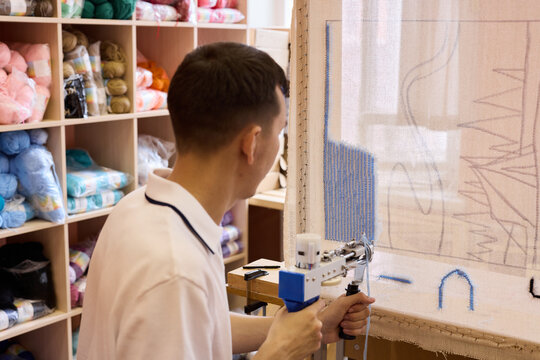 Crafting a tapestry with precision and skill in workshop setting