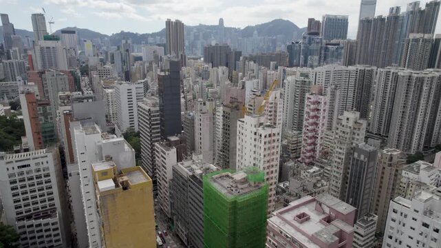Hong Kong top-down Aerial view over the Kowloon district, and busy Mong Kok streets.