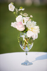 Elegant Miniature Floral Arrangement in Wine Glass