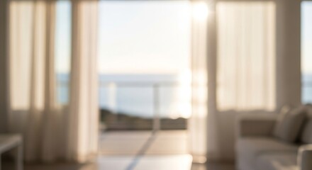 Blurred view of the ocean from a bright room with curtains and furniture, creating a serene and relaxing atmosphere.