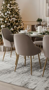 Elegant dining room table set for Christmas dinner with festive tree.