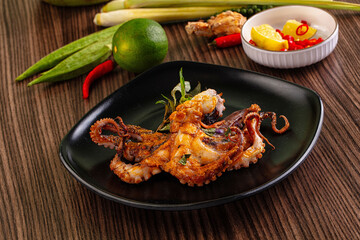 Gourmet grilled whole octopus served lime