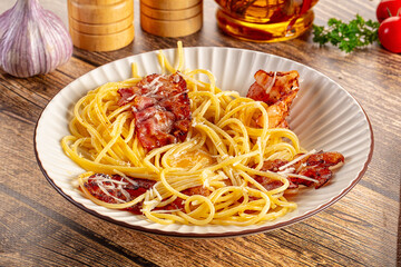 Italian classic spaghetti carbonara with bacon and egg