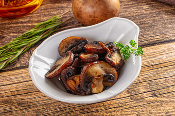Fried champignon slices in the plate
