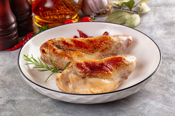 Roasted rabbit leg served rosemary