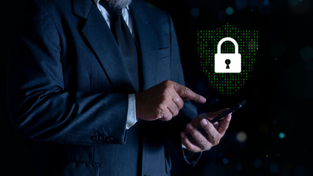 Businessman using Smartphone with Padlock icon and internet technology networking. protecting data personal information. privacy security. Data protection privacy. Cyber security network.