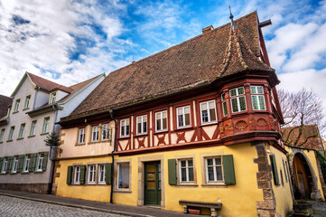 Colorful medieval house, known as the Feuerleinserker, in the historic center of Rothenburg ob der Tauber, Germany