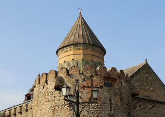 Dome with cross of The Svetitskhoveli Cathedral  with Blue Sky Background in Mtskheta, Georgia