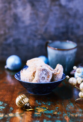 Traditional christmas cookies in a bowl on a rustic wooden background. Soft focus.	