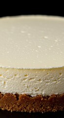 A close up view of a smooth, creamy cheesecake surface ready for topping or decoration, providing a delicious food background texture ,simple ,surface ,dough