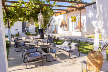 Modern outdoor patio with cushioned seating and pergola decor