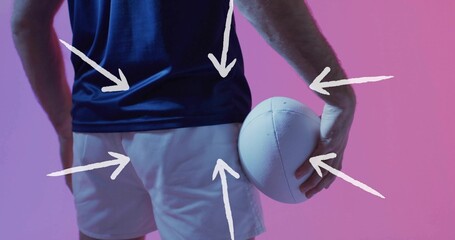 Holding white ball, athlete torso showing navy shirt and white shorts in studio with arrow graphics