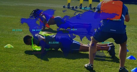 Performing player wearing neon green bib doing plank on grass pitch, with cones, blue data map