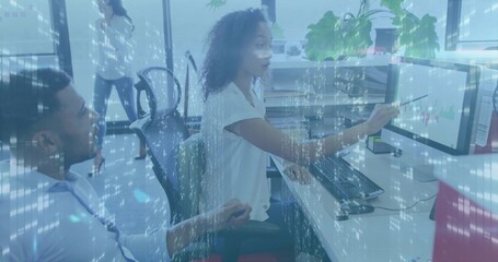 Pointing seated woman in white blouse explaining charts on open-plan office monitor, blue overlay