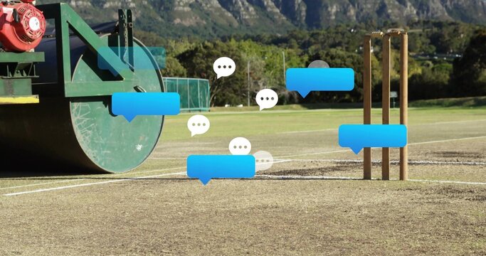 Sitting green field roller on left of cricket pitch, showing stumps and chat bubbles, copy space - Powered by Adobe