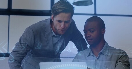Leaning two men in business attire studying laptop at office with grid windows, HUD