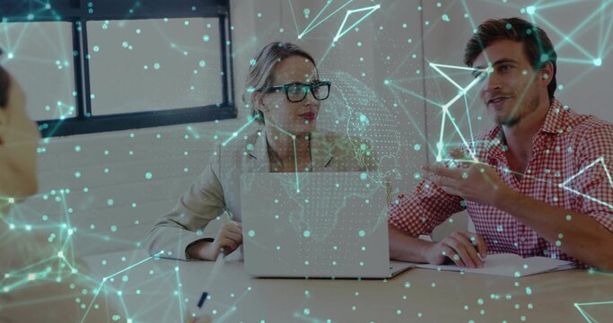 Meeting team of three in business attire reviewing laptop and papers at office, holographic overlay