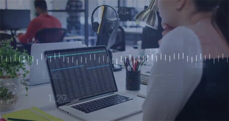 Leaning female worker in white top vest studying laptop data at desk, waveform overlay, copy space