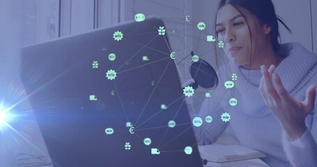 Talking woman in chunky sweater gesturing at home on laptop mic popfilter, icon overlay, copy space