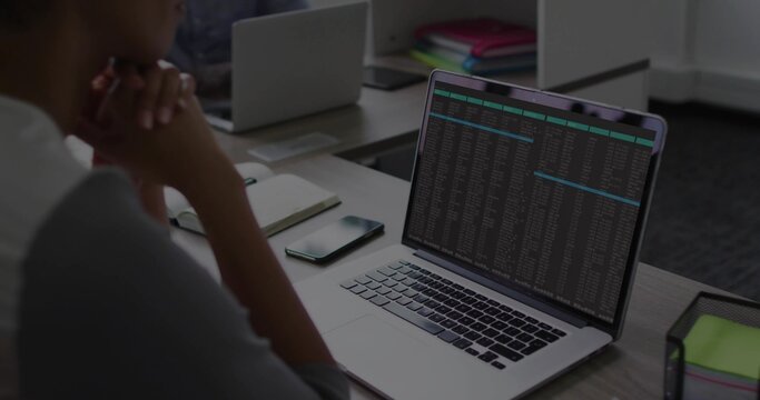 Showing silver laptop running terminal in office, man wearing light top, sticky notes, copy space - Powered by Adobe
