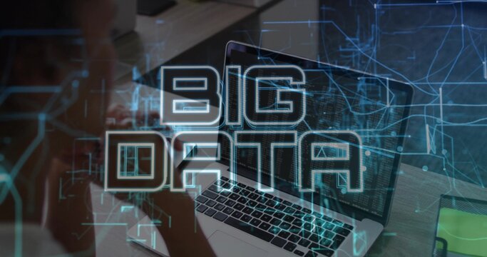 Showing laptop screen running code and data at desk, with smartphone, notepad, BIG DATA overlay