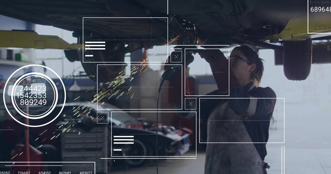 Grinding mechanic in apron and gloves using grinder under raised car in garage, producing sparks - Powered by Adobe