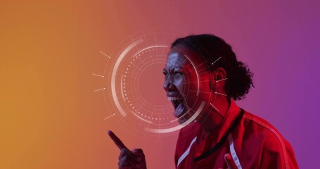 Shouting woman in red sports jacket white trim pointing finger at HUD studio, copy space