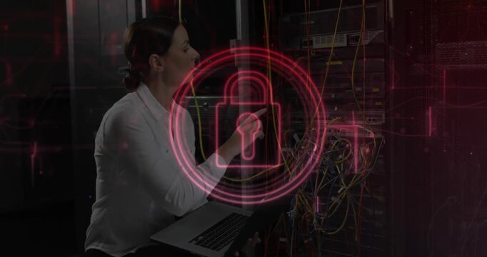 IT tech tracing yellow cable rack, causing red lock growing, settling over patch panel with laptop