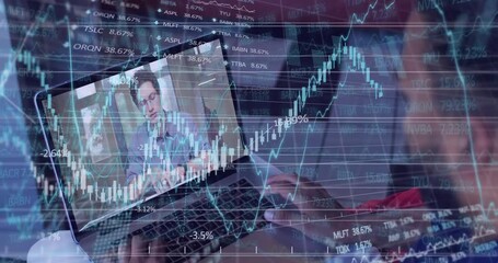 User typing on laptop, starting moving finance charts while colleague speaking for market update