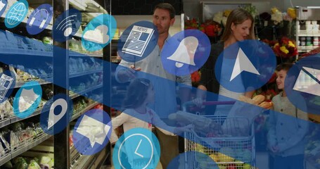 Family grocery aisle dad pointing selecting goods as mom pushing cart with loaf, app icons sweeping - Powered by Adobe