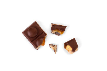 Chocolate bar with caramel, nougat and nuts filling isolated on white background.